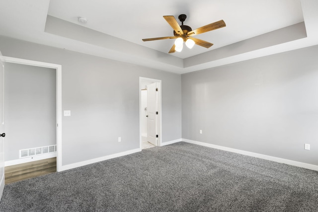3306 Tuscany, Columbia, MO 65202 - carpeted empty room with a ceiling fan, a smoke detector, and a raised ceiling