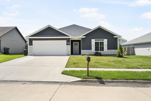 3306 Tuscany, Columbia, MO 65202 - view of front facade featuring an attached garage, a front yard, concrete driveway, and stone siding