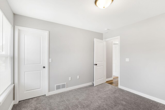 3306 Tuscany, Columbia, MO 65202 - unfurnished bedroom with carpet flooring and baseboards