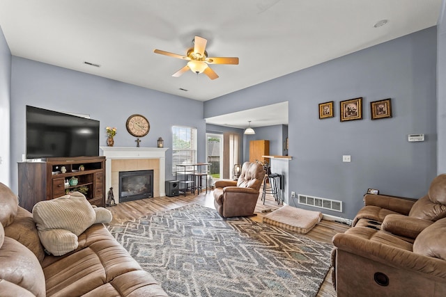 6610 Chrissula Ln, Columbia, MO 65203 - living area with ceiling fan, wood finished floors, and a tile fireplace