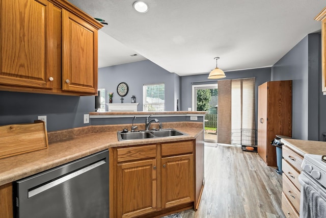 6610 Chrissula Ln, Columbia, MO 65203 - kitchen with dishwashing machine, light wood-type flooring, brown cabinetry, a peninsula, and decorative light fixtures
