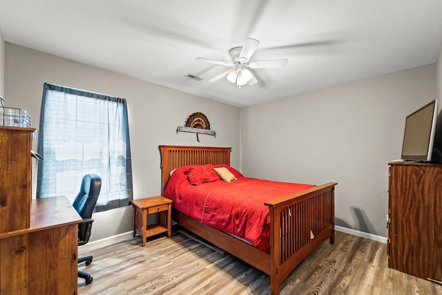 6610 Chrissula Ln, Columbia, MO 65203 - bedroom featuring wood finished floors, a desk, and ceiling fan