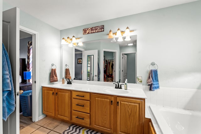 6610 Chrissula Ln, Columbia, MO 65203 - full bathroom with double vanity, a garden tub, tile patterned flooring, and a spacious closet