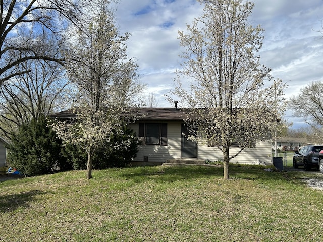 6009 E Eric Ln, Columbia, MO 65202 - obstructed view of property with a front lawn