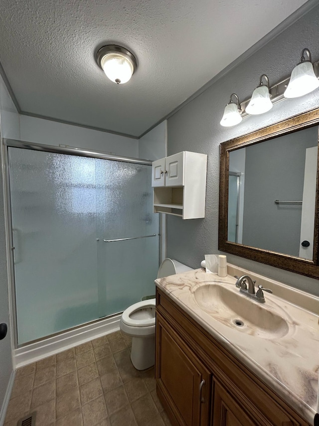 6009 E Eric Ln, Columbia, MO 65202 - bathroom featuring vanity, a shower stall, a textured ceiling, and a textured wall