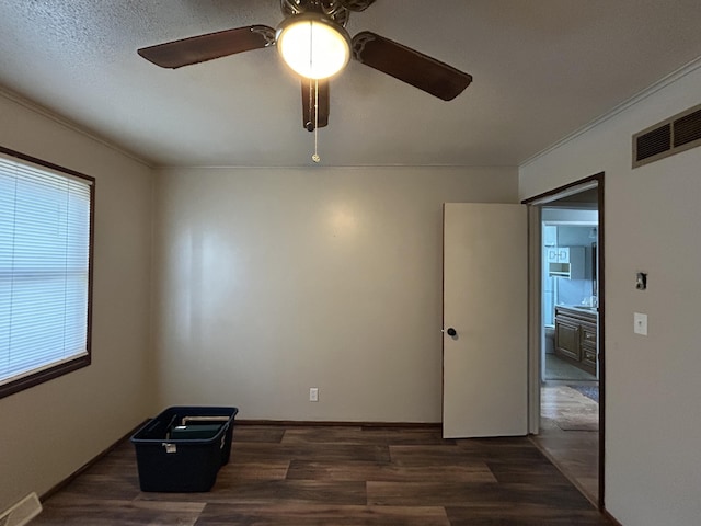 6009 E Eric Ln, Columbia, MO 65202 - unfurnished room featuring a ceiling fan, wood finished floors, and crown molding