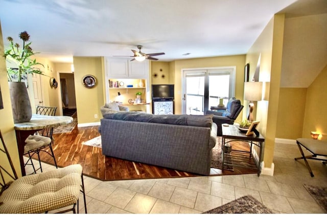 1902 Park Deville Pl, Columbia, MO 65203 - living room featuring ceiling fan and light tile patterned floors