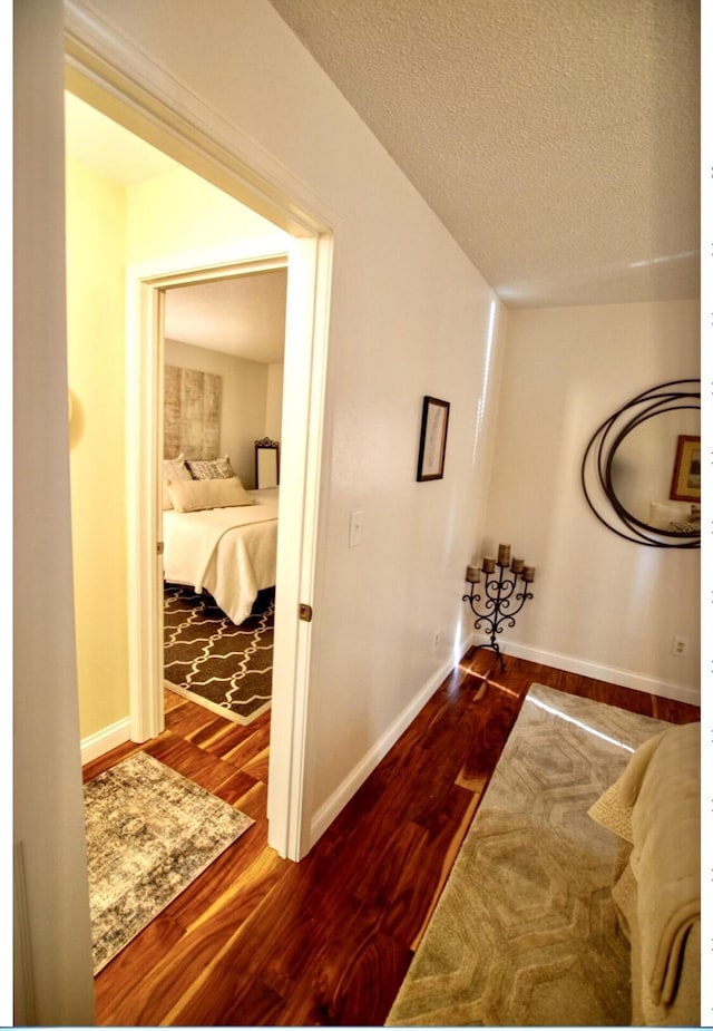 1902 Park Deville Pl, Columbia, MO 65203 - hallway with dark wood-type flooring and a textured ceiling