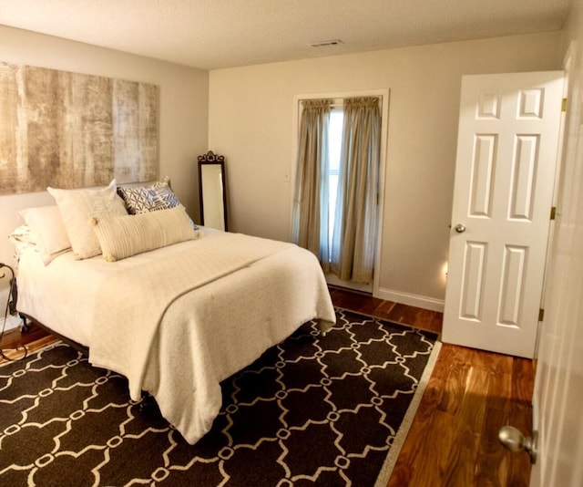 1902 Park Deville Pl, Columbia, MO 65203 - bedroom featuring wood finished floors and baseboards