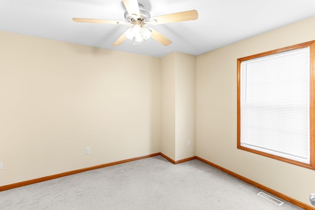 2208-2210 Shamrock Dr, Columbia, MO 65202 - empty room featuring light colored carpet and ceiling fan