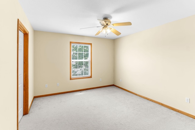 2208-2210 Shamrock Dr, Columbia, MO 65202 - spare room featuring light colored carpet and a ceiling fan