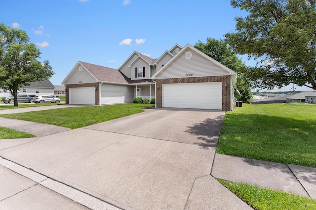 2208-2210 Shamrock Dr, Columbia, MO 65202 - traditional-style home with brick siding, an attached garage, a front lawn, and concrete driveway