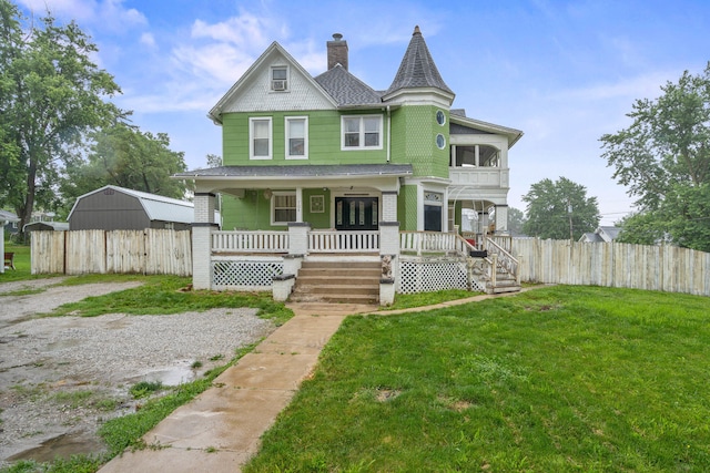 704 N Jefferson St, Mexico, MO 65265 - victorian home featuring roof with shingles, covered porch, and a chimney