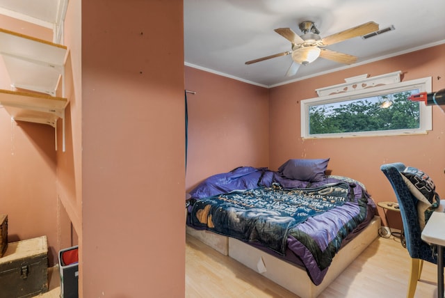 704 N Jefferson St, Mexico, MO 65265 - bedroom featuring wood finished floors, crown molding, and ceiling fan