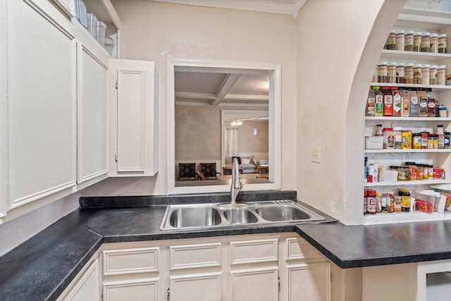 704 N Jefferson St, Mexico, MO 65265 - kitchen with dark countertops, white cabinets, ornamental molding, and beamed ceiling