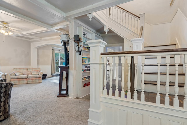 704 N Jefferson St, Mexico, MO 65265 - stairway with ceiling fan, carpet flooring, coffered ceiling, beam ceiling, and a wainscoted wall