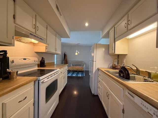 1999 N Waterfront Dr Unit H, Columbia, MO 65202 - kitchen featuring white appliances, under cabinet range hood, white cabinetry, light countertops, and recessed lighting