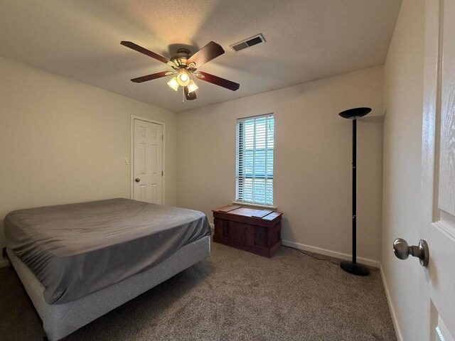 1999 N Waterfront Dr Unit H, Columbia, MO 65202 - carpeted bedroom featuring baseboards and ceiling fan
