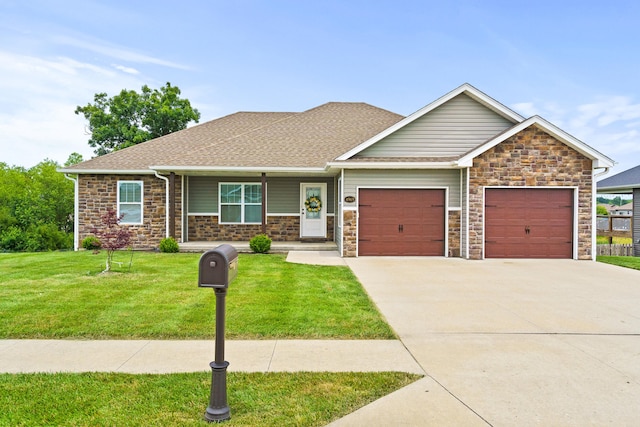 4969 W Red Tail Dr, Ashland, MO 65010 - craftsman inspired home featuring an attached garage, stone siding, concrete driveway, and a front lawn