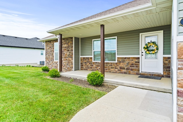 4969 W Red Tail Dr, Ashland, MO 65010 - entrance to property featuring covered porch, stone siding, a yard, and roof with shingles