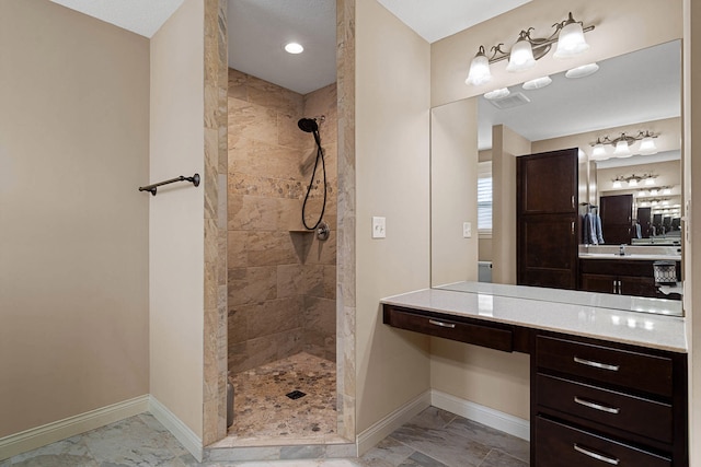 4969 W Red Tail Dr, Ashland, MO 65010 - bathroom with marble look tiles, a tile shower, and vanity