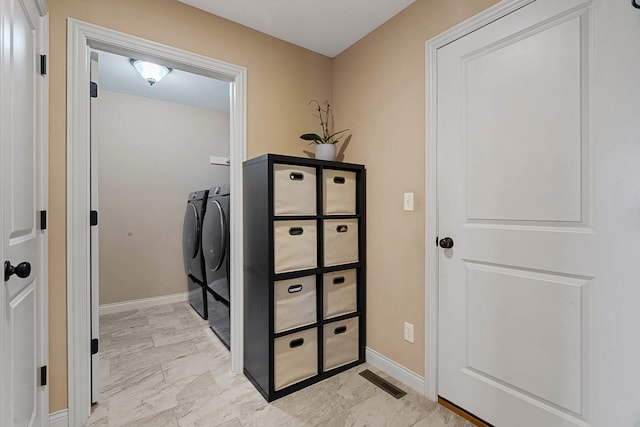 4969 W Red Tail Dr, Ashland, MO 65010 - laundry area featuring independent washer and dryer and light marble finish flooring