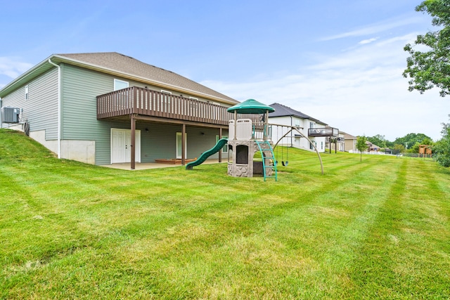 4969 W Red Tail Dr, Ashland, MO 65010 - back of property featuring a lawn, a wooden deck, and a playground
