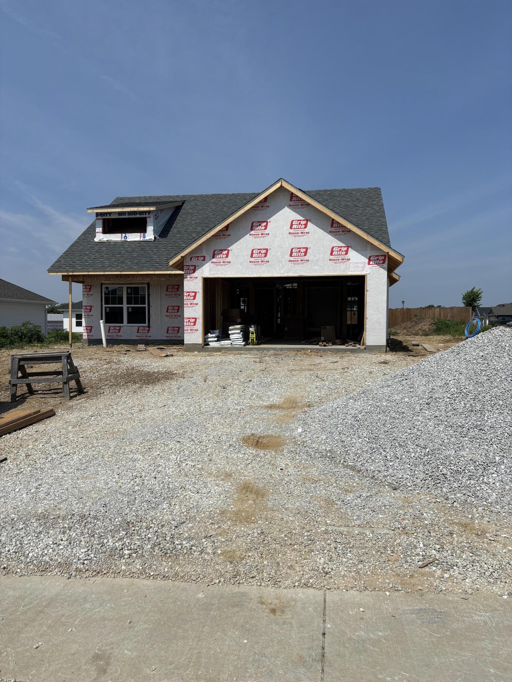 2313 Bitternut Ct, Columbia, MO 65201 - property in mid-construction featuring driveway and a shingled roof