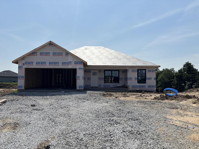 5724 Blackgum Ct, Columbia, MO 65202 - unfinished property featuring an attached garage and gravel driveway