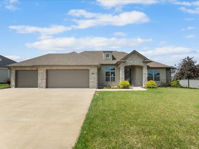 5204 Newbury Way, Columbia, MO 65203 - view of front of home featuring stone siding, concrete driveway, a front yard, an attached garage, and roof with shingles