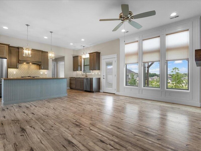 5204 Newbury Way, Columbia, MO 65203 - kitchen with stainless steel appliances, backsplash, recessed lighting, wood finished floors, and ceiling fan