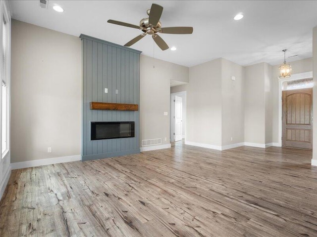 5204 Newbury Way, Columbia, MO 65203 - unfurnished living room featuring wood finished floors, a ceiling fan, a fireplace, and recessed lighting