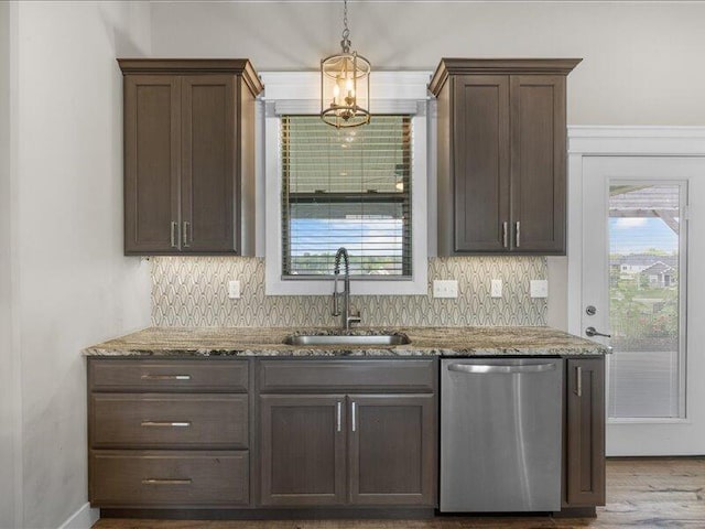 5204 Newbury Way, Columbia, MO 65203 - kitchen with stainless steel dishwasher, light stone countertops, dark brown cabinets, and decorative backsplash