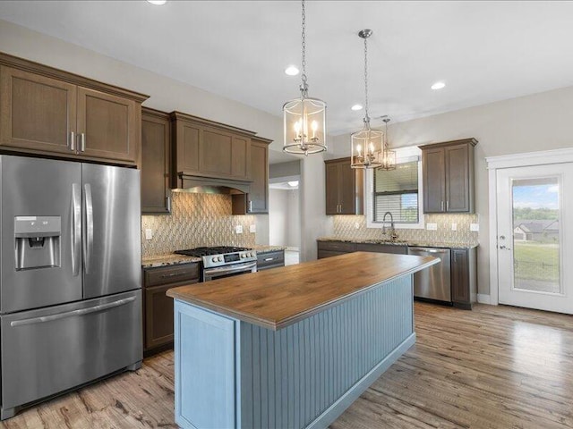 5204 Newbury Way, Columbia, MO 65203 - kitchen featuring appliances with stainless steel finishes, wooden counters, a chandelier, light wood-style floors, and recessed lighting
