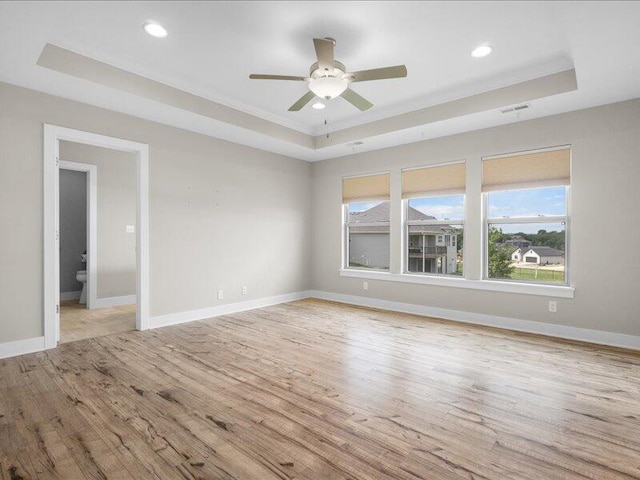 5204 Newbury Way, Columbia, MO 65203 - spare room with a raised ceiling, wood finished floors, ceiling fan, recessed lighting, and crown molding