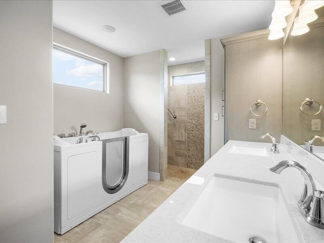 5204 Newbury Way, Columbia, MO 65203 - bathroom with healthy amount of natural light, a tile shower, double vanity, and a bath