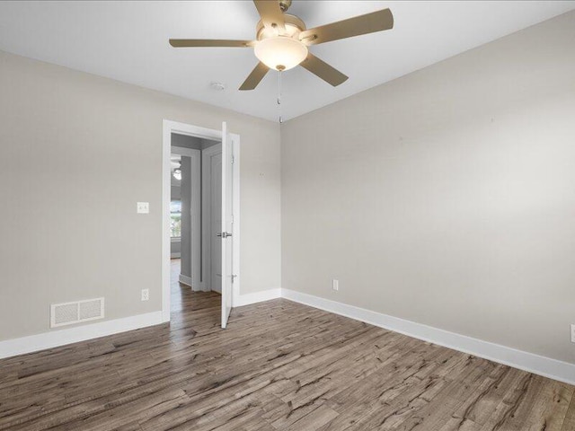 5204 Newbury Way, Columbia, MO 65203 - empty room with wood finished floors, ceiling fan, and a smoke detector