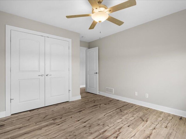 5204 Newbury Way, Columbia, MO 65203 - unfurnished bedroom featuring wood finished floors, a closet, and a ceiling fan