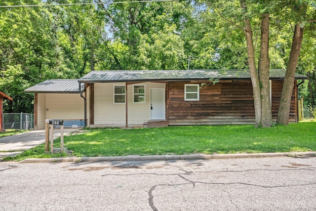 504 1st St, Boonville, MO 65233 - view of front of home with a metal roof, driveway, and entry steps
