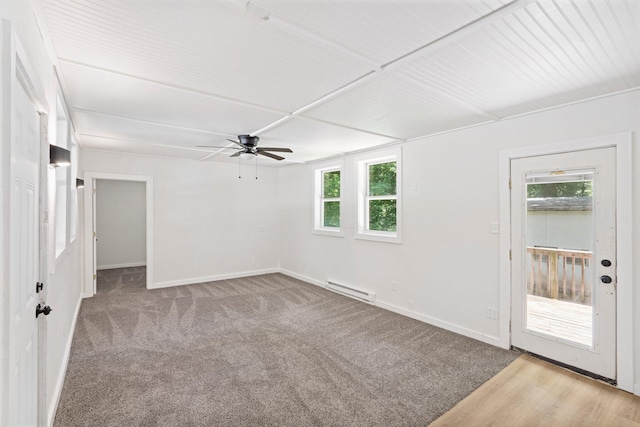 504 1st St, Boonville, MO 65233 - spare room featuring a baseboard heating unit, a ceiling fan, and carpet flooring