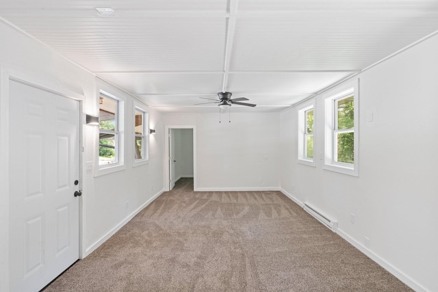 504 1st St, Boonville, MO 65233 - empty room with a baseboard radiator, carpet floors, healthy amount of natural light, and a ceiling fan