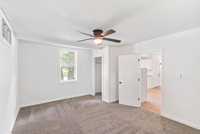 504 1st St, Boonville, MO 65233 - unfurnished bedroom featuring carpet floors, a closet, and a ceiling fan