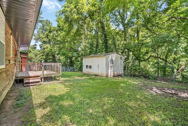 504 1st St, Boonville, MO 65233 - view of green lawn with a shed and a wooden deck