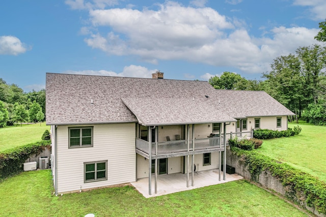 902 S Cedar Grove Blvd, Columbia, MO 65201 - back of house with a patio area, a yard, a chimney, and roof with shingles