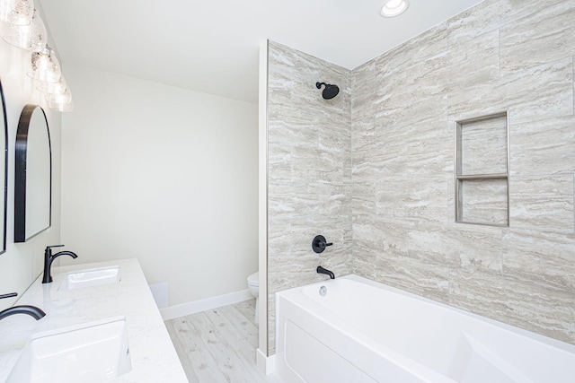 902 S Cedar Grove Blvd, Columbia, MO 65201 - bathroom featuring double vanity, bathtub / shower combination, wood finished floors, and recessed lighting