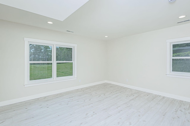 902 S Cedar Grove Blvd, Columbia, MO 65201 - spare room featuring light wood finished floors, recessed lighting, a smoke detector, and a skylight