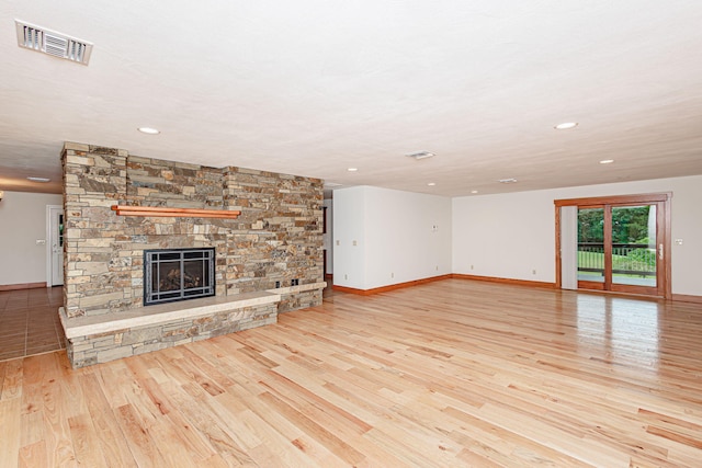 902 S Cedar Grove Blvd, Columbia, MO 65201 - unfurnished living room featuring wood finished floors, a fireplace, and recessed lighting