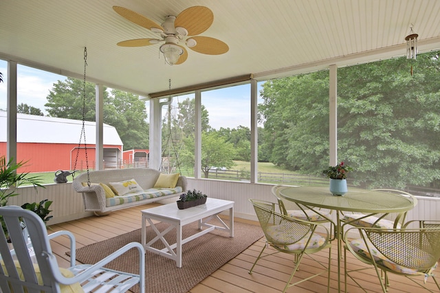 5200 N Locust Grove Church Rd, Columbia, MO 65202 - sunroom with a ceiling fan, plenty of natural light, and view of scattered trees