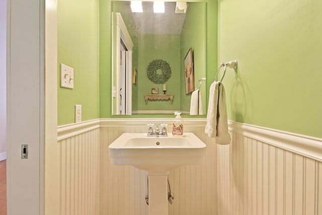 5200 N Locust Grove Church Rd, Columbia, MO 65202 - bathroom featuring wainscoting and a decorative wall