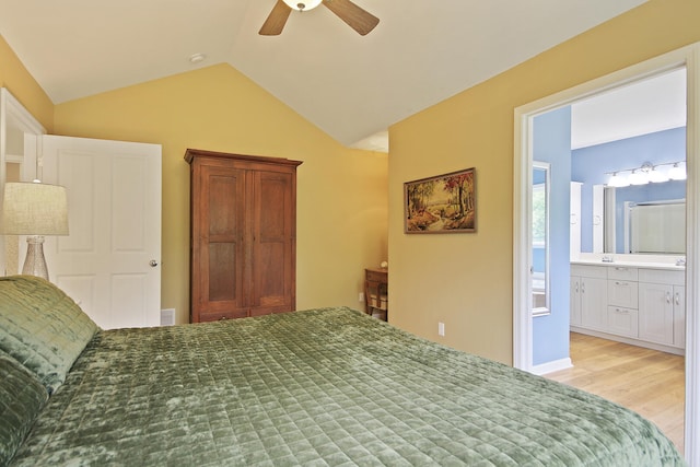 5200 N Locust Grove Church Rd, Columbia, MO 65202 - bedroom featuring vaulted ceiling, wood finished floors, ceiling fan, and ensuite bathroom